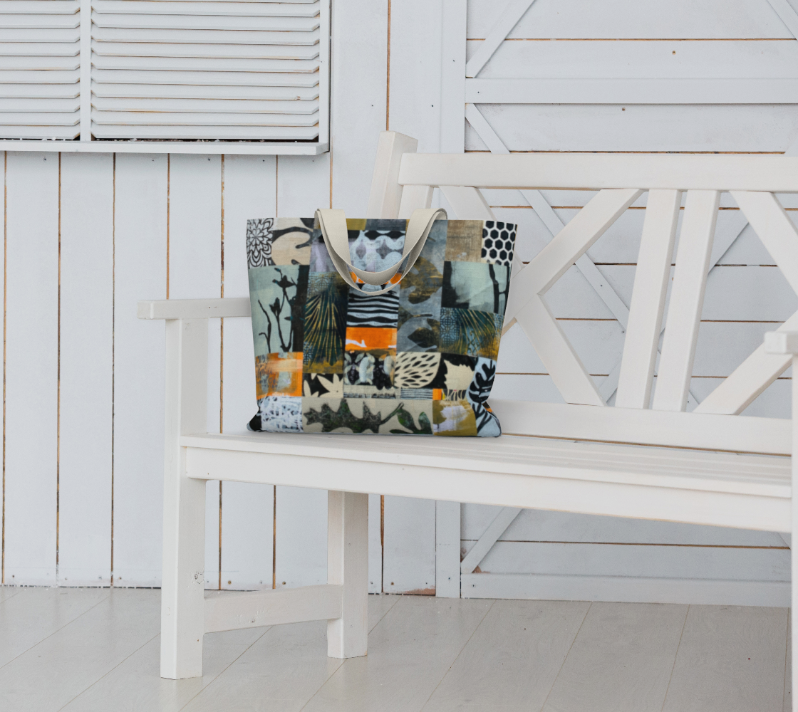 Colorful patterned tote bag on a white bench against a white wooden wall.