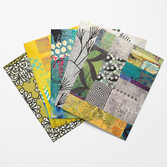 Set of colorful patterned notebooks on a white background