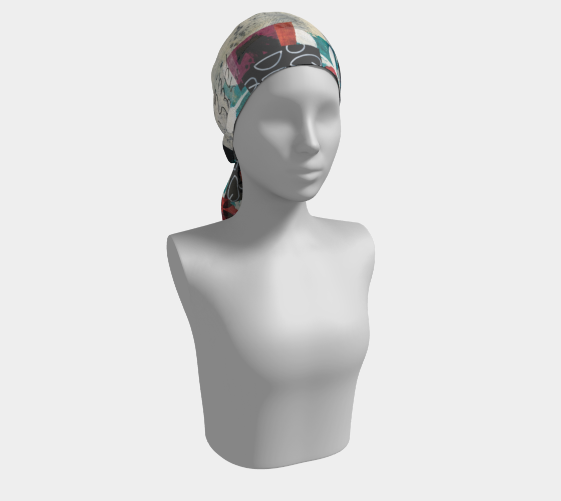 Mannequin head wearing a colorful headscarf on a plain background