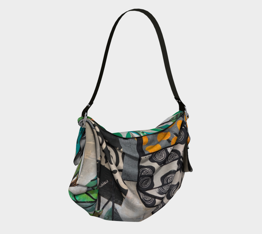 Patterned handbag with a visible brand logo on a light gray background