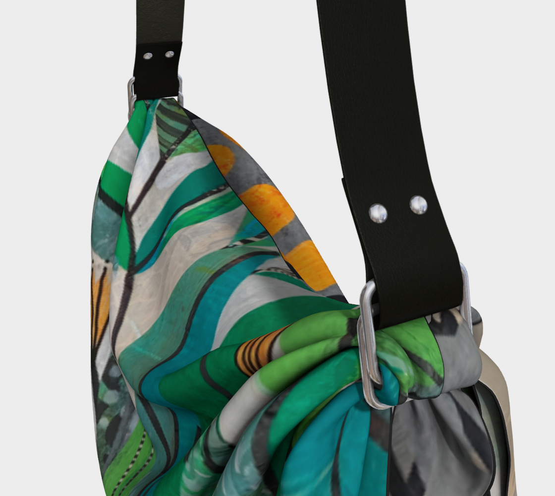 Colorful patterned bag with a black strap on a light gray background