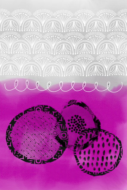 Two black circular objects with patterns on a pink and gray background