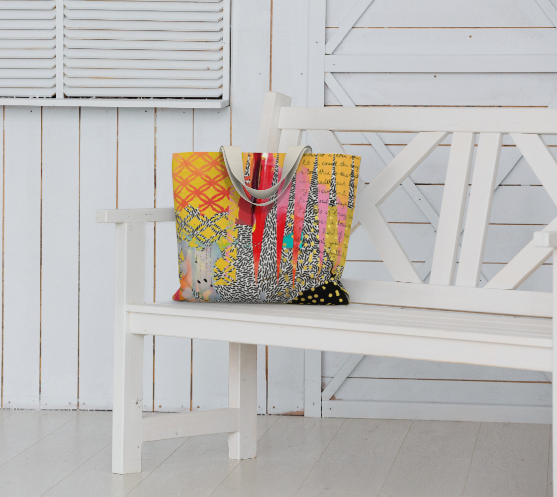 Colorful patterned bag on a white bench against a white wooden wall.