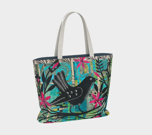 Tote bag with bird and floral design on a white background