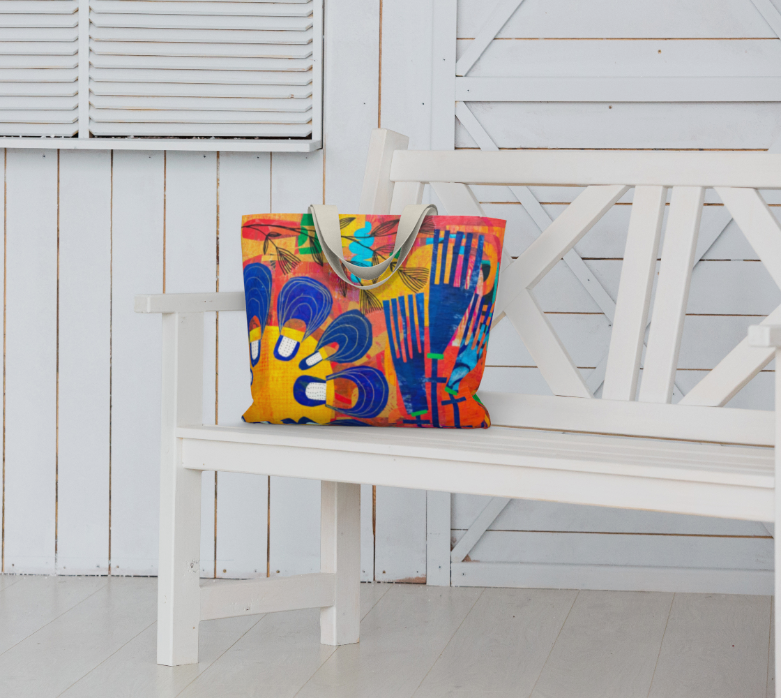 Colorful tote bag with abstract design on a white bench against a white wooden wall.