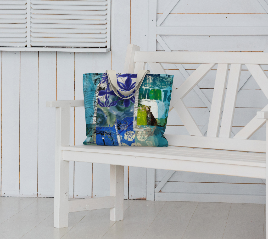 Colorful tote bag on a white bench with a white wooden background