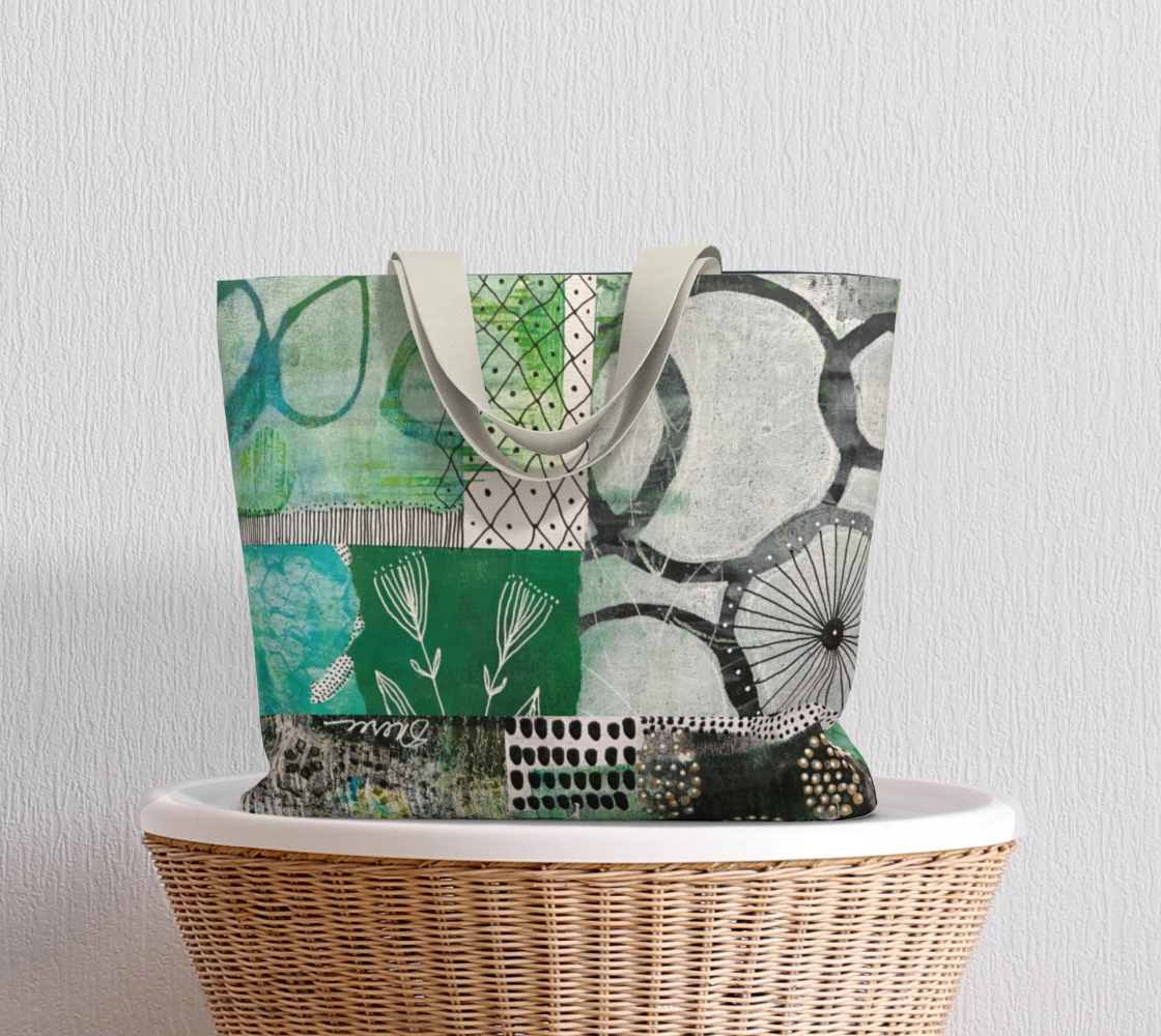 Patterned tote bag on a wicker chair against a light gray wall