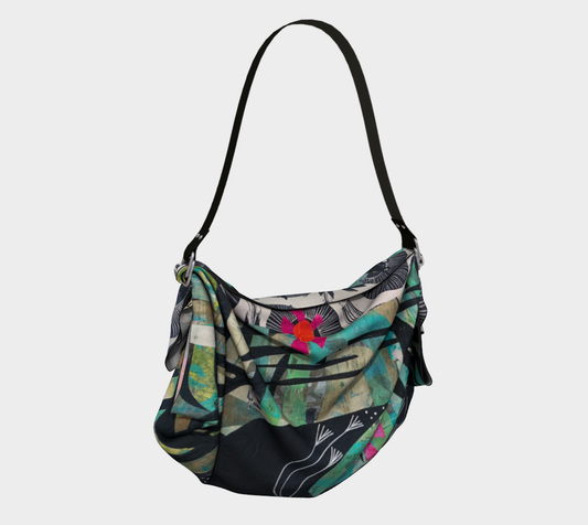 Colorful handbag with floral pattern on a light gray background