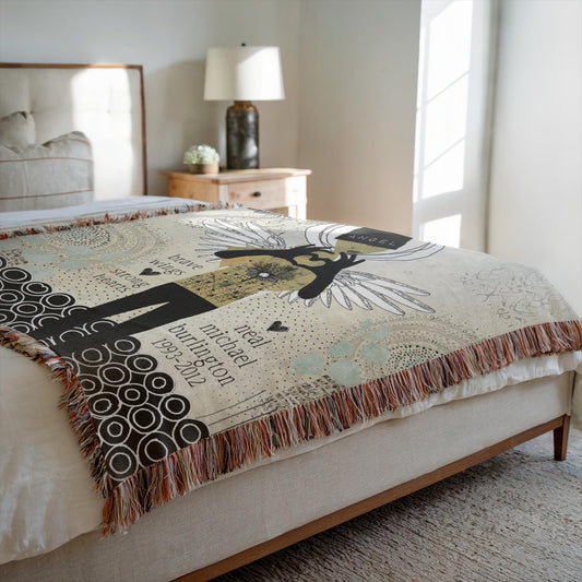 Decorative blanket with artistic design on a bed in a bedroom setting
