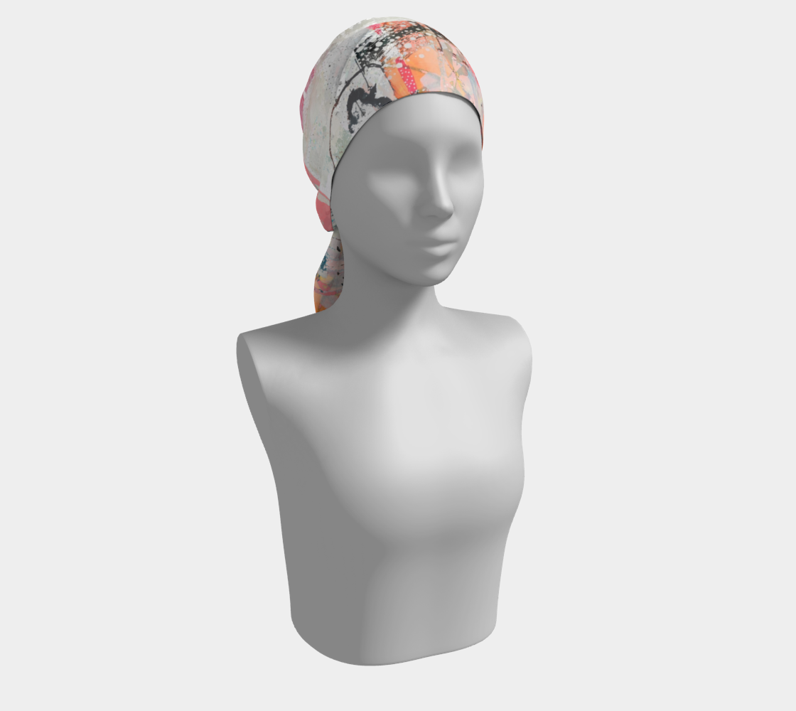 Mannequin head wearing a patterned headscarf on a white background