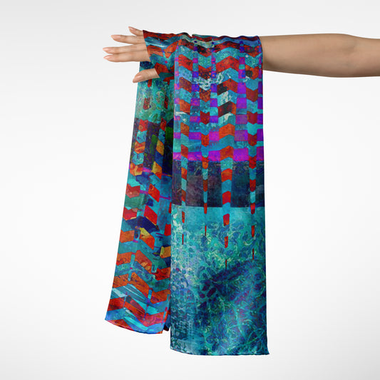 Colorful patterned scarf held by a person on a white background
