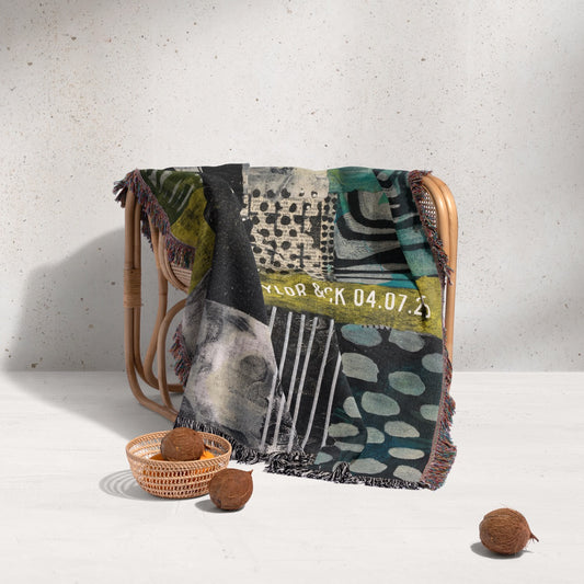 Textile with a pattern draped over a chair against a light background