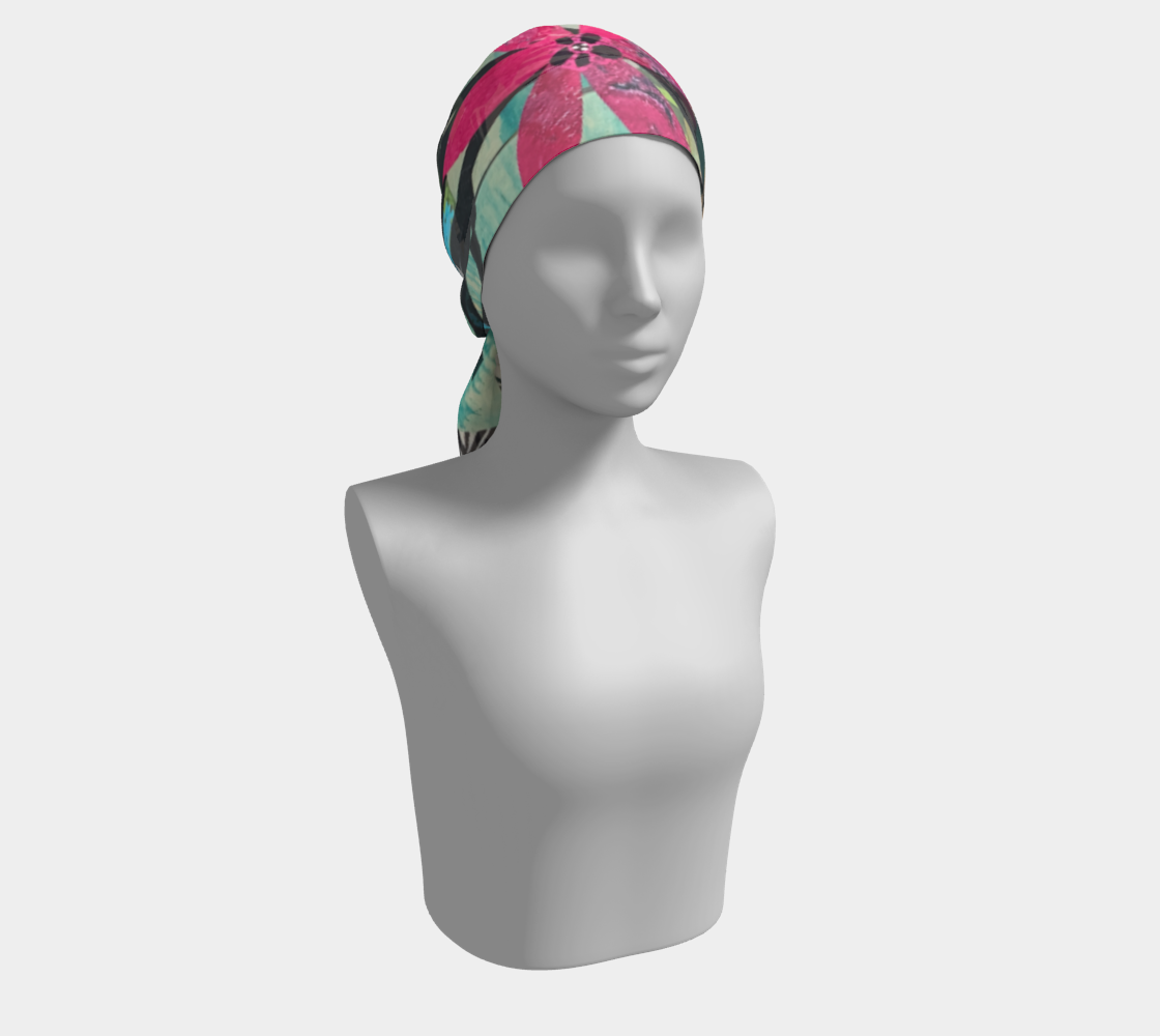 Mannequin head wearing a colorful headscarf on a white background
