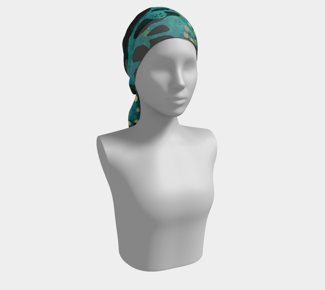 Mannequin head wearing a teal patterned headscarf on a white background