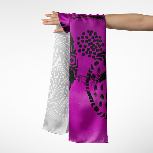 Purple scarf with black and white patterns draped over a person's arm on a white background