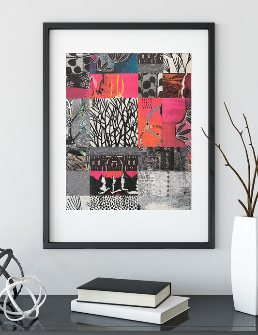 A framed abstract art print featuring a colorful patchwork of black, pink, orange, and gray patterns, displayed on a shelf with books and a vase in a modern room setting.
