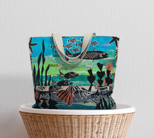 Tote bag with fish and underwater scene design on a white surface