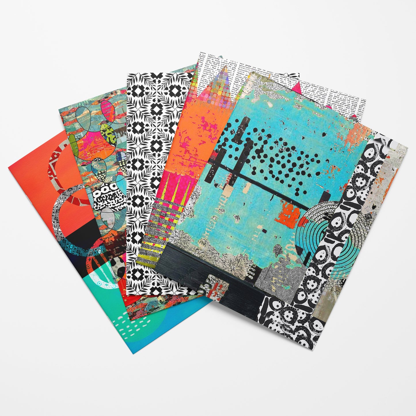Set of colorful patterned notebooks on a white background