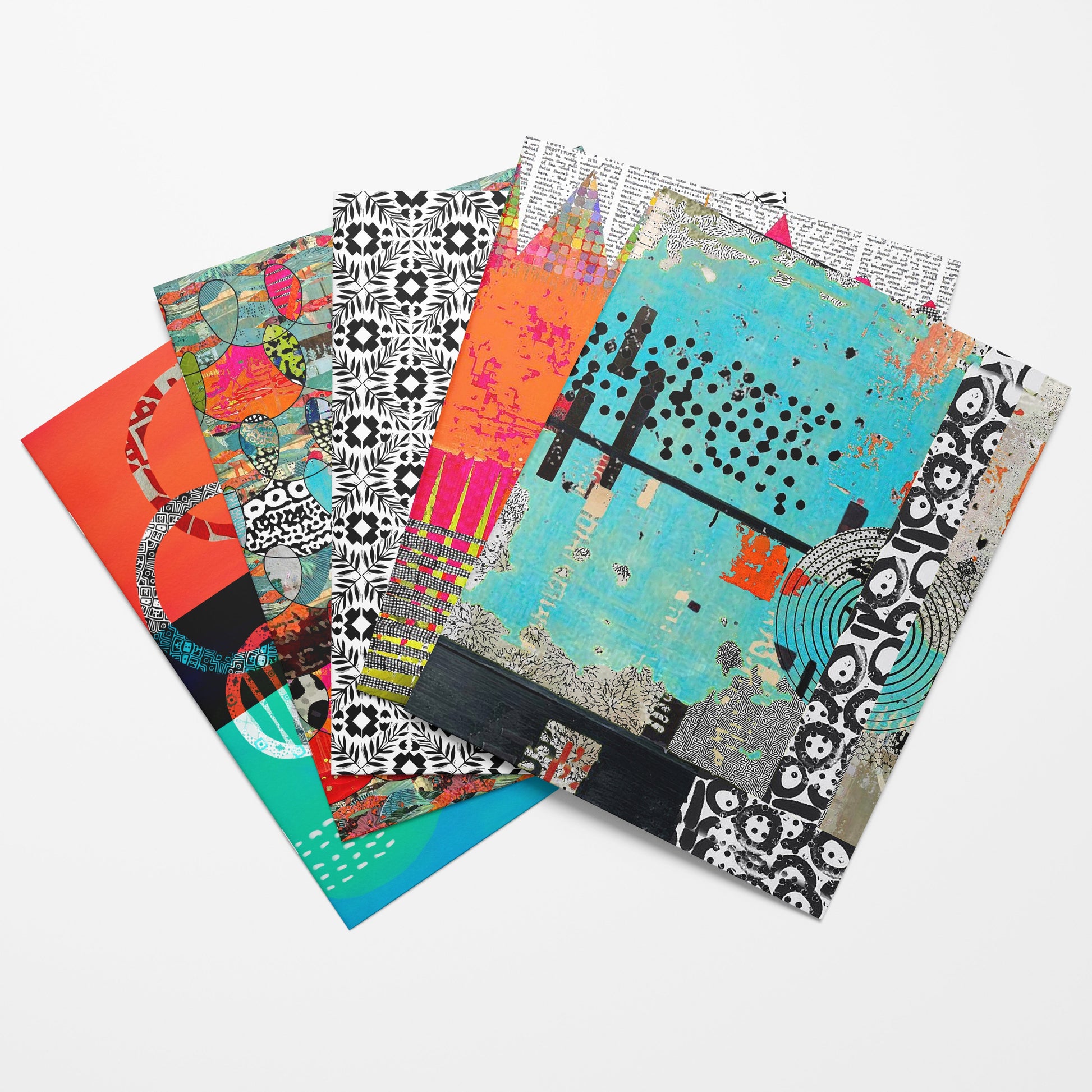 Set of colorful patterned notebooks on a white background