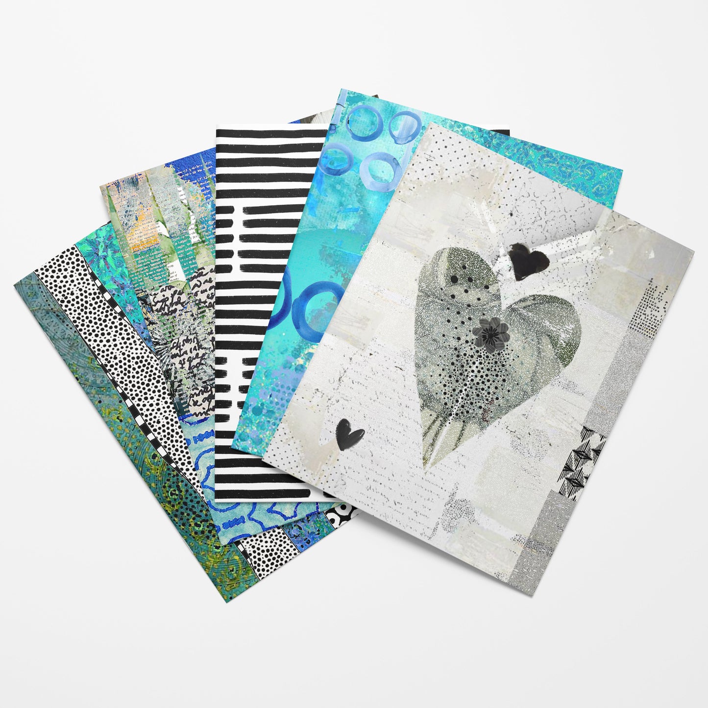 A fan of mixed-media artist papers with various abstract patterns and a central bird design, displayed on a clean white background.