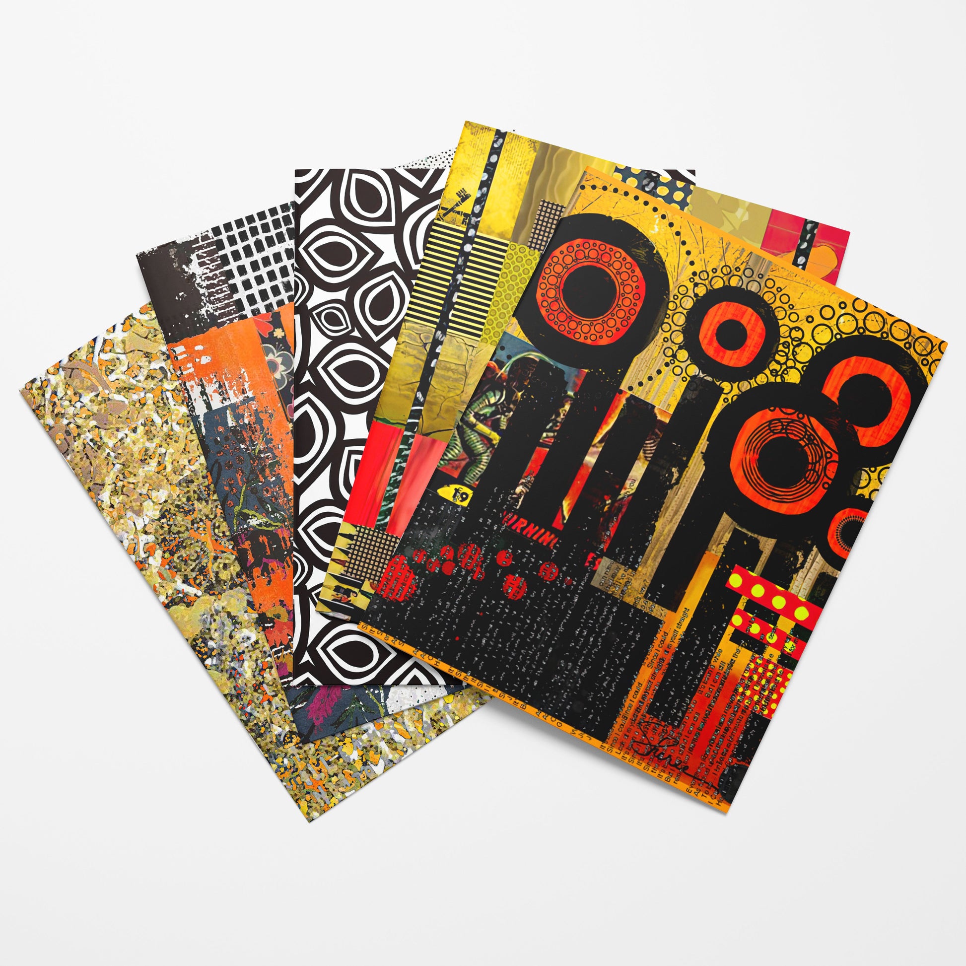 A fan arrangement of five abstract art paper sheets with mixed patterns including black and white circles, orange and black concentric circles, and gold, black, and red collage elements, displayed on a light gray background.