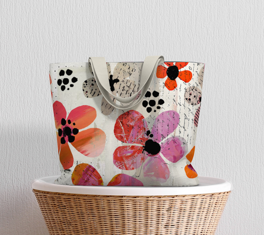Floral-patterned tote bag on a wicker basket  against a light gray wall