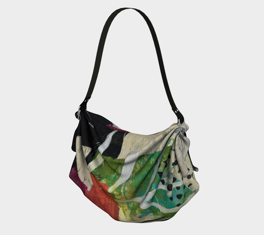 Multicolored handbag with a black strap on a white background