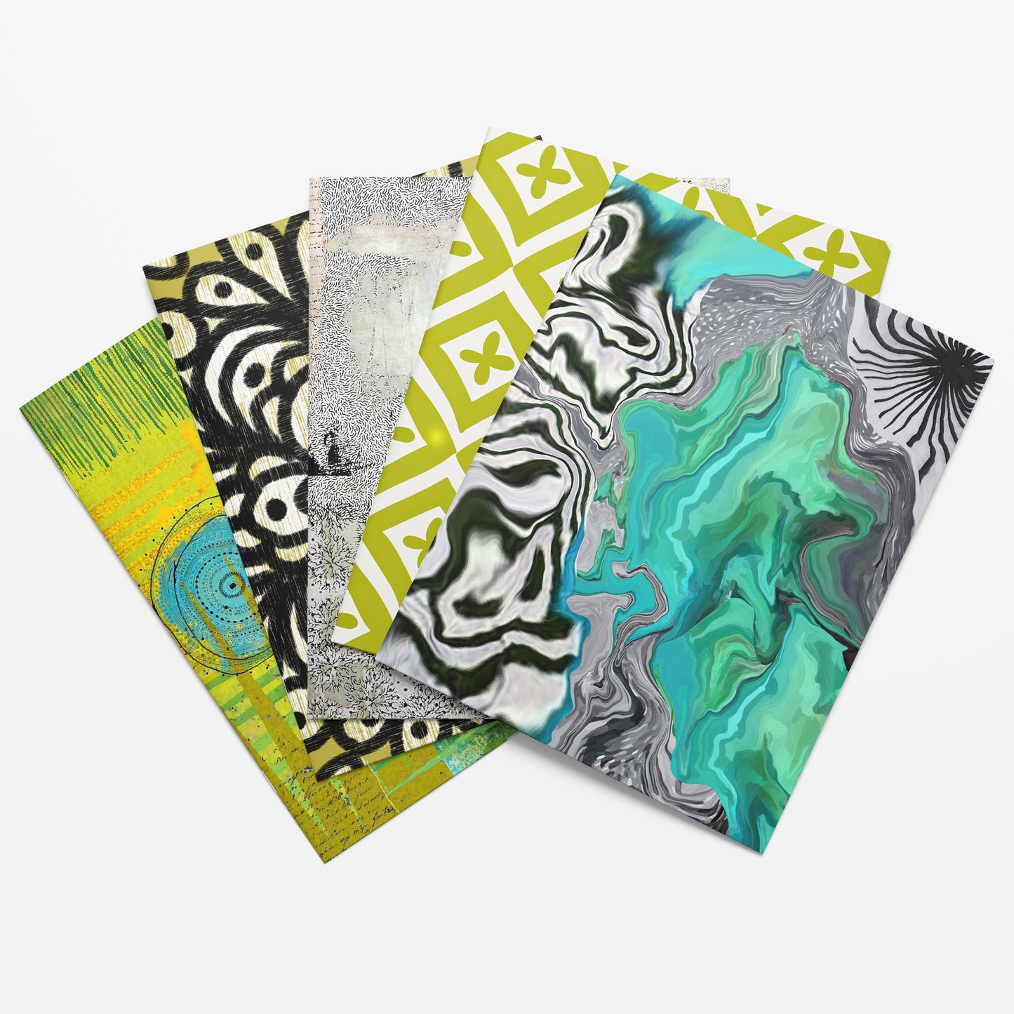 Four colorful patterned notebooks stacked on a white background