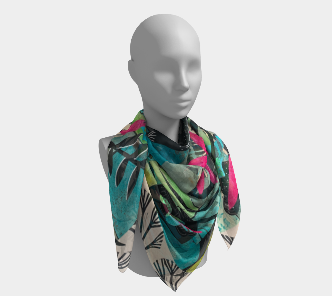 Mannequin wearing a colorful scarf with a leaf pattern on a white background