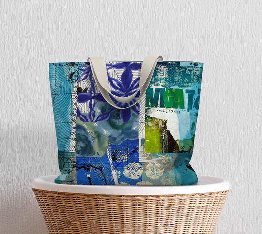 Colorful tote bag with abstract design on a wicker chair against a light gray wall