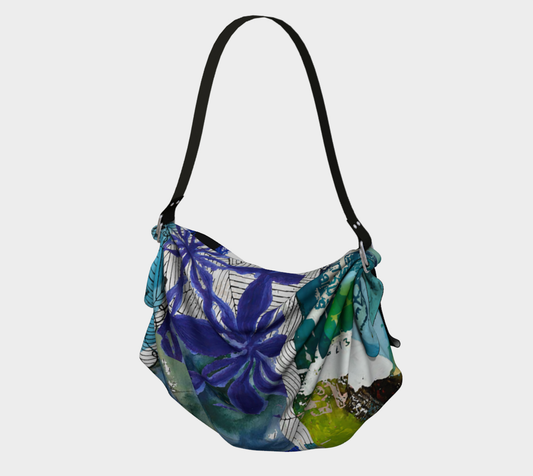 Multicolored ocean themed floral-patterned bag on a white background