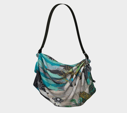 Floral patterned bag with a black strap on a white background