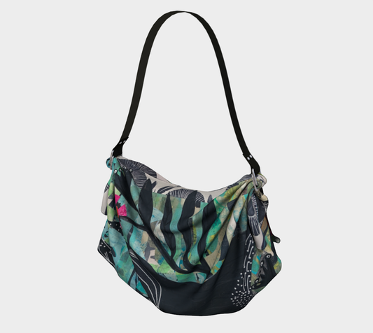Multicolored patterned handbag on a light gray background