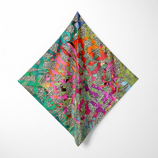 Colorful patterned fabric square on a white background