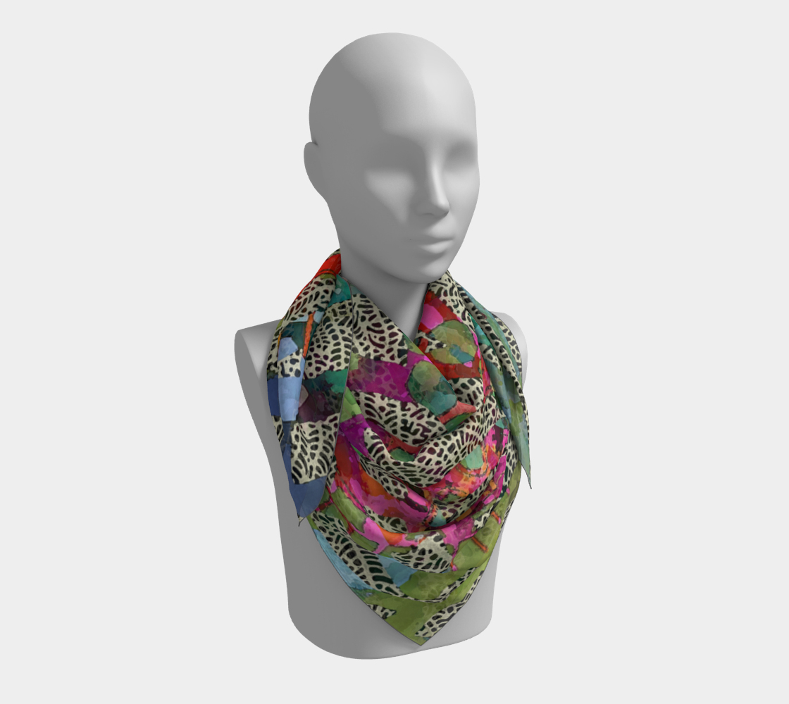 Mannequin wearing a colorful patterned scarf on a white background