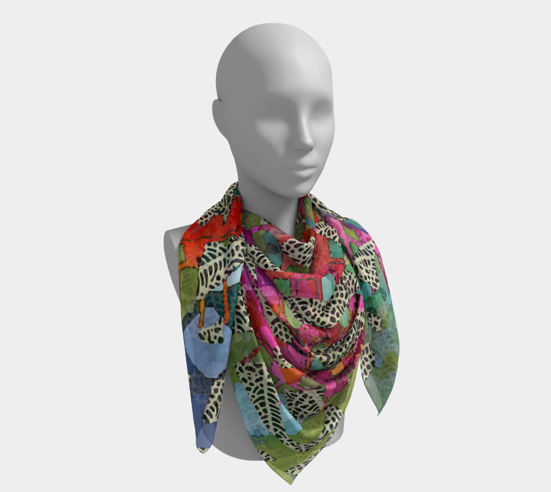 Mannequin wearing a colorful patterned scarf on a white background