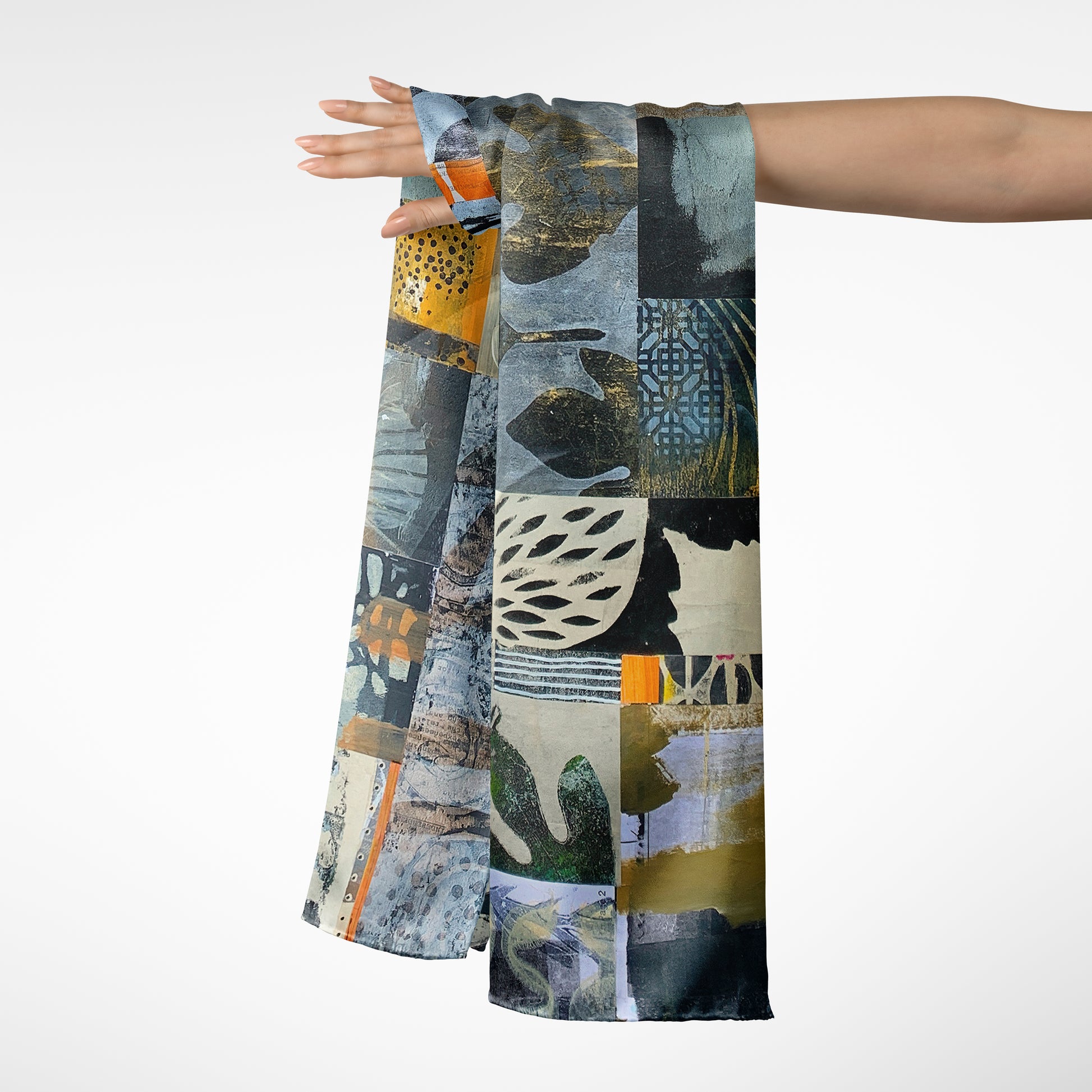 Abstract patterned scarf being held up against a white background
