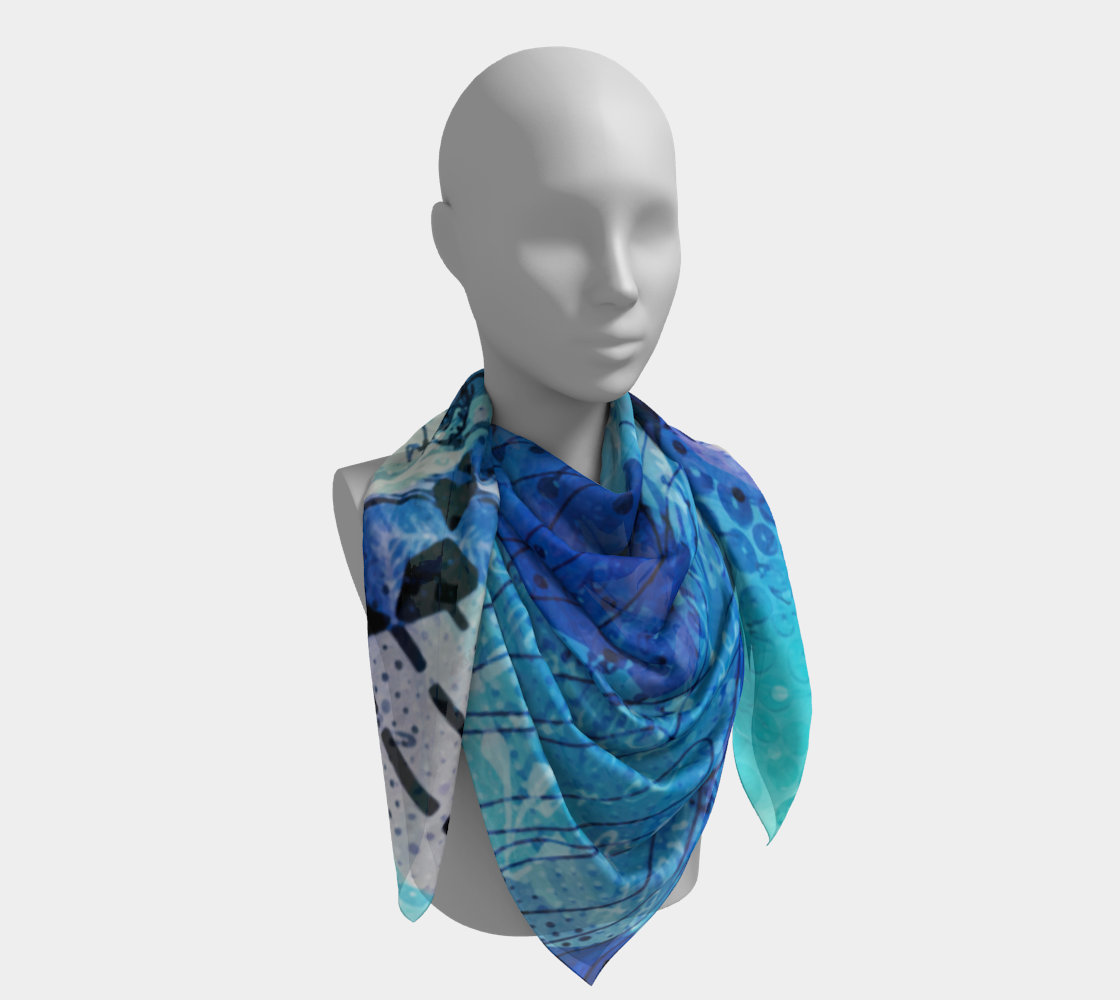 Mannequin wearing a blue patterned scarf on a white background