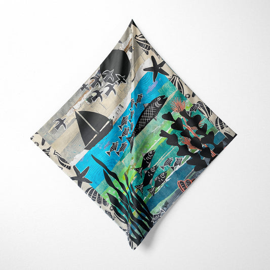 Decorative pillow with ocean-themed design on a white background