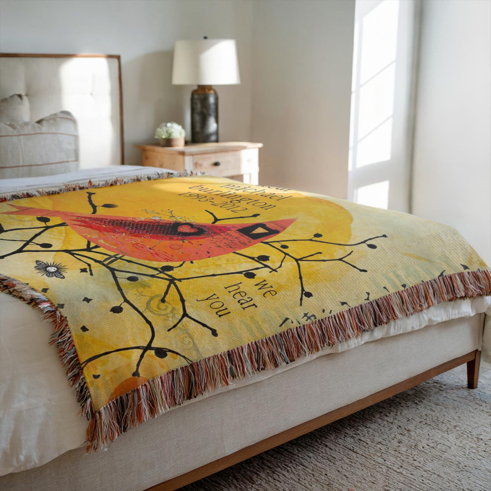 Decorative blanket with a colorful design on a bed in a bedroom setting