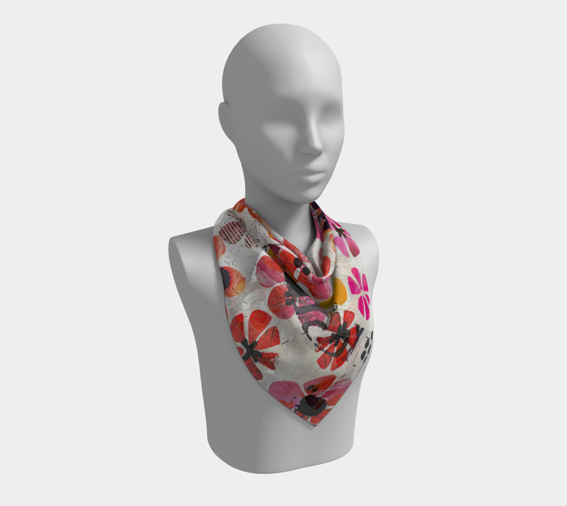 Mannequin wearing a floral patterned scarf on a white background