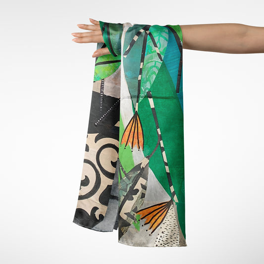 Colorful scarf with abstract patterns draped over a person's arm on a white background