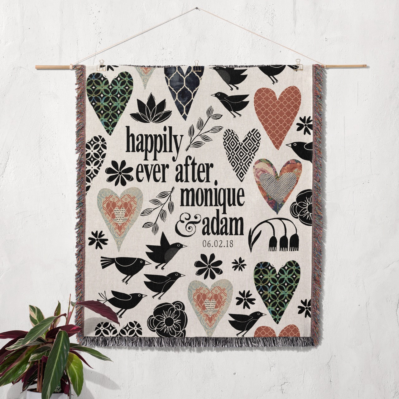 Decorative wall hanging with hearts, birds, and text on a white background