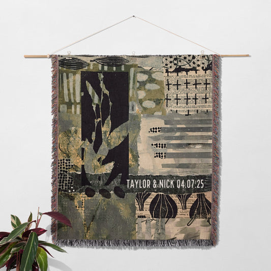 Textile art piece with abstract patterns and personalized text on a white wall.