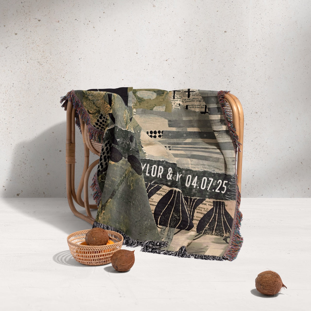 Textile with artistic design and text on a wooden chair against a light gray background