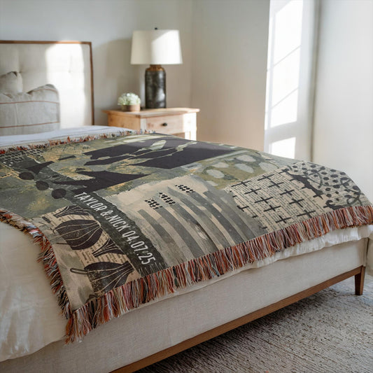 Decorative blanket with nature-themed design on a bed in a bedroom setting.