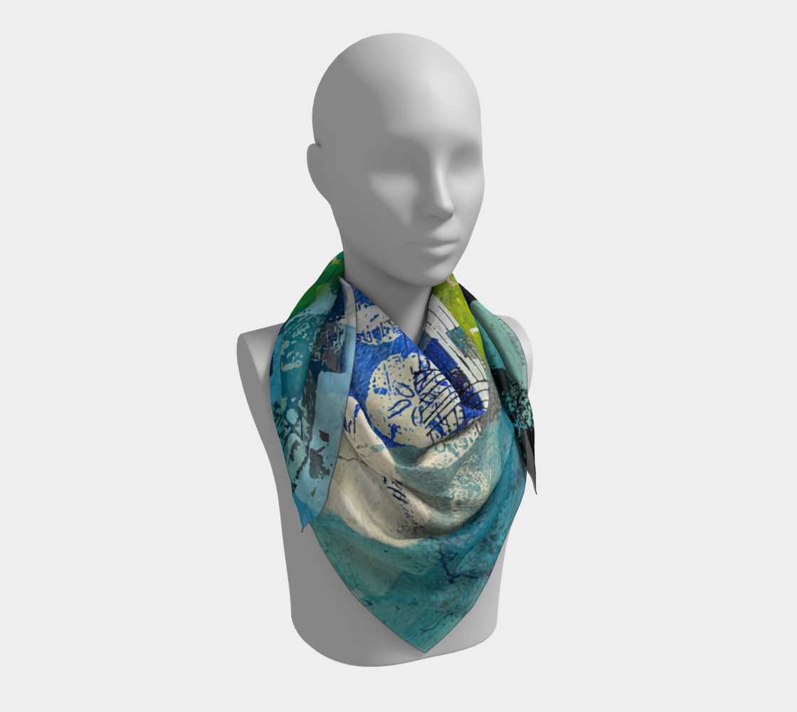Mannequin wearing a colorful scarf with a blue and white pattern on a light gray background