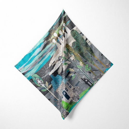 Decorative pillow with nature-themed design on a white background