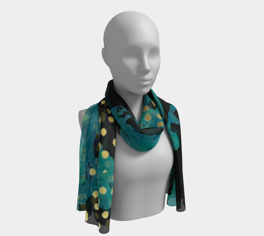 Mannequin wearing a teal scarf with black and yellow polka dots on a white background