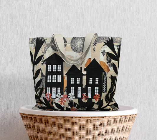 Tote bag with house and floral design on a wicker chair against a light gray background